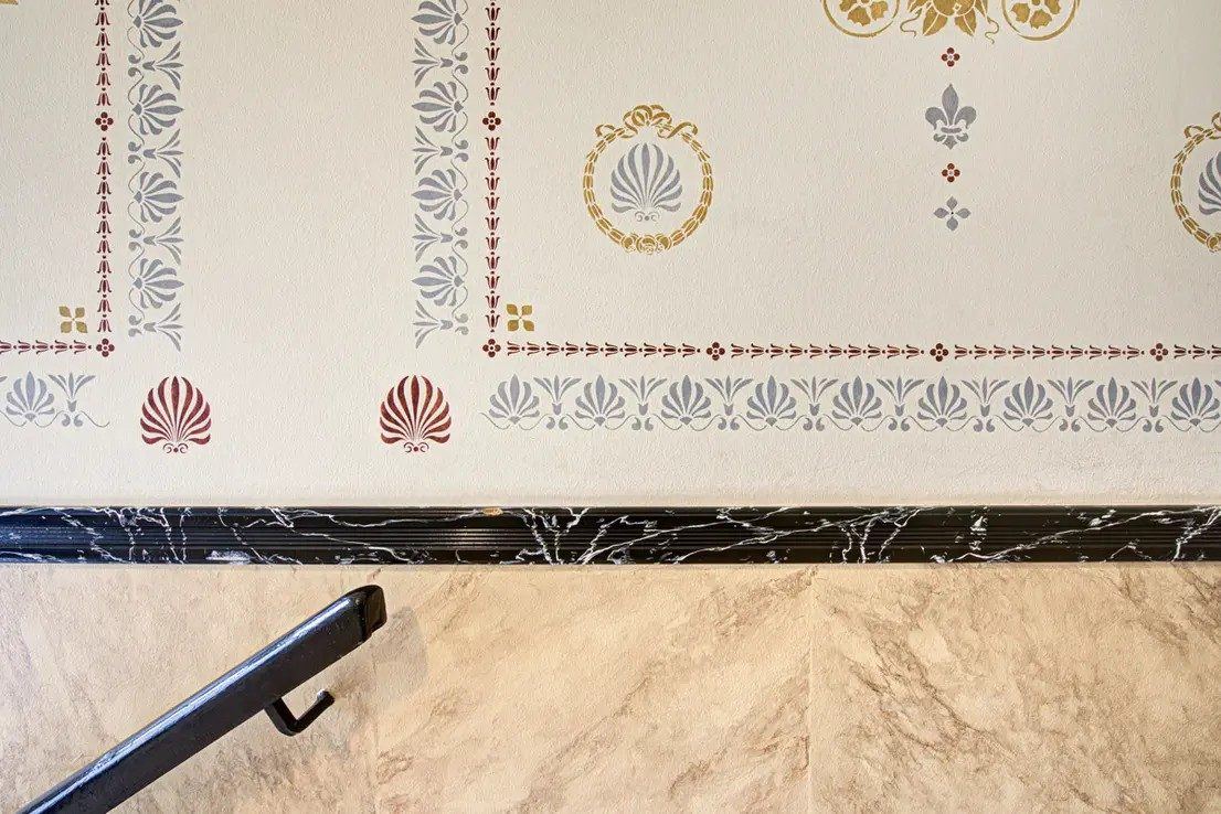 Stairwell with restored stencil painting